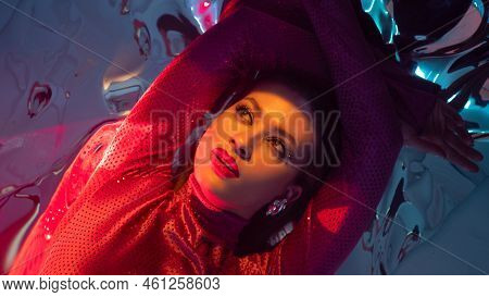Portrait Of A Young Beautiful Woman On A Shimmering Silver Background, Iridescent Colored Light, Fut