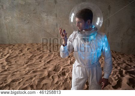 Astronaut On A Desert Planet Alone, Explorer On Distant Planet, Other Worlds And Civilizations. Youn