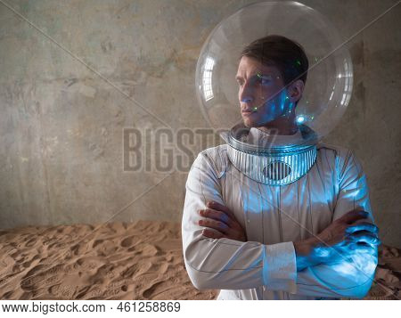 Heroic Astronaut In A Retrofuturism-style Spacesuit On A Desert Planet, A Hologram Of Star Systems O