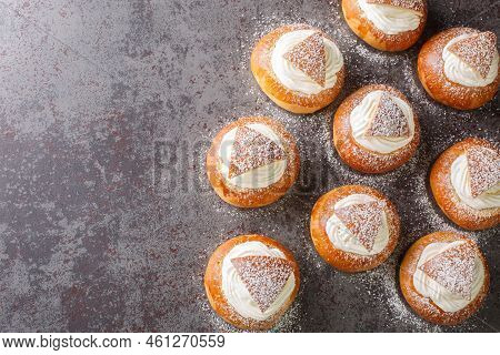 Sweet Buns With Frangipane And Whipped Cream Close-up On The Table. Horizontal Top View From Above