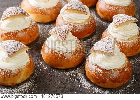 Scandinavian Sweet Buns Stuffed With Frangipane And Whipped Cream Close-up On The Table. Horizontal