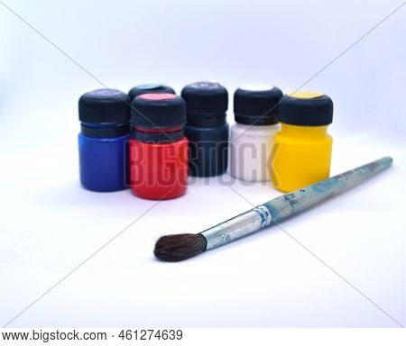 Art Brush And Acrylic Paints On A White Background.