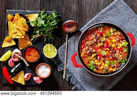 Taco Soup Of Ground Beef, Tomatoes, Chopped Green Chilis, Onions, Corn, Red Beans And Taco Seasoning