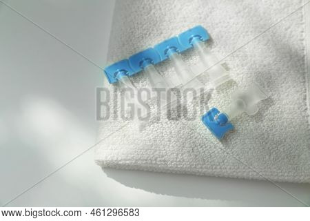 Single Dose Eye Drops And Towel On White Table, Closeup