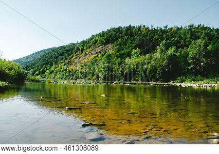 Beautiful Mountain River On A Clear Summer Day. River In Sunny Day. River In Mountain Forest.