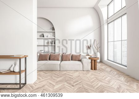 White Living Room Interior With Sofa, Sideboard And Shelf With Books, Hardwood Floor. Panoramic Wind