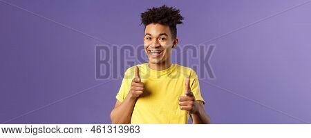 Believe In You. Portrait Of Cheerful Young Optimistic Guy Encuraging To Keep Going, Pointing Fingers