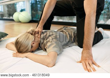 Female Patient Lying Gymnastic Mat Receiving Yumeiho Japanese Back And Neck Massage With Alternative