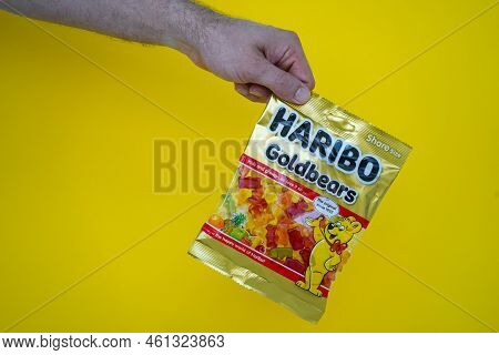Pskov, Russia - August 09, 2022: A Man Keeps Up To Date With A Pack Of Haribo Chewing Bears On A Yel
