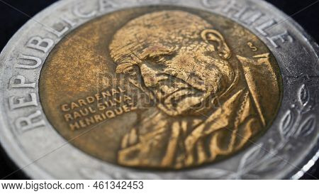 Translation: Republic Of Chile. Coin Of 500 Chilean Pesos Closeup. Peso Of Chile. News About Economy