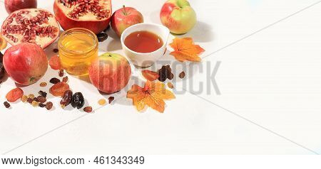 Autumn Banner With Honey, Apples, Pomegranates, Flowers, Dried Fruits On A Light Background With Pla
