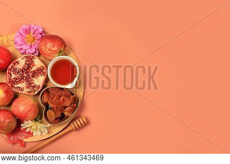 Autumn Banner With Honey, Apples, Pomegranates, Flowers, Dried Fruits On A Warm Orange Background, C