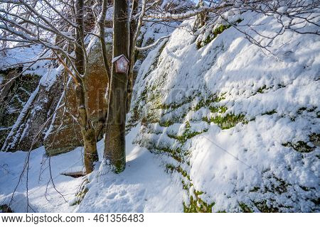 Granite Rock Formation Granicznik Covered By Snow. Winter Forest Of Jizera Mountains, Poland