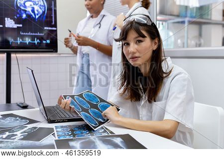 Female Medical Student Study In Class Room. Medical Students Studying Human Brain Disease Diagnosis 