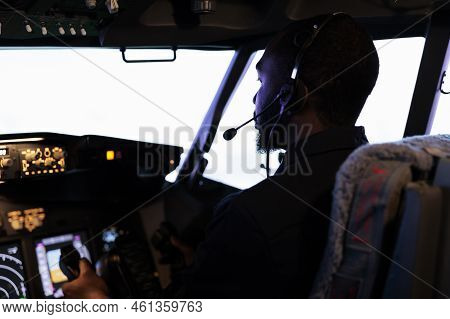 African American Copilot Holding Lever To Takeoff With Airplane, Flying Aircraft With Dashboard Powe