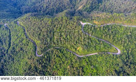 Aerial View Of A Hilltop Road With Beautiful Green Forests In Thailand. Aerial Capture With Drone.