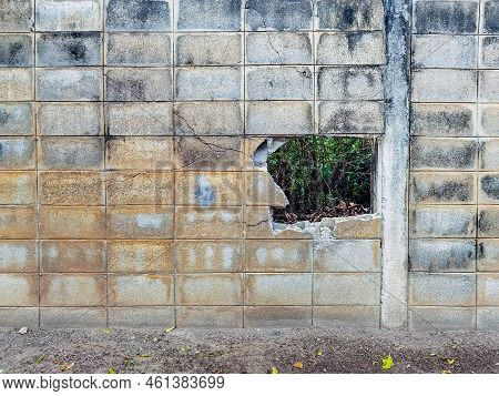 Dirty Old Eroded Cracked Plaster Cement Block Fence. Concrete Block Wall. Destroyed Crumbling Cement