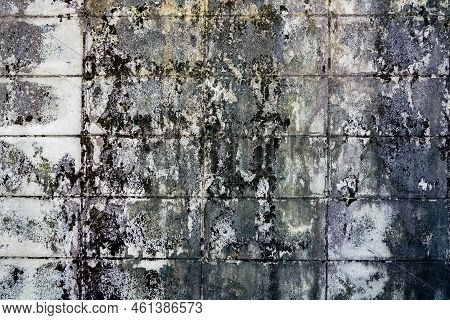Dirty Old Eroded Cracked Plaster Cement Block Fence. Concrete Block Wall. Destroyed Crumbling Cement