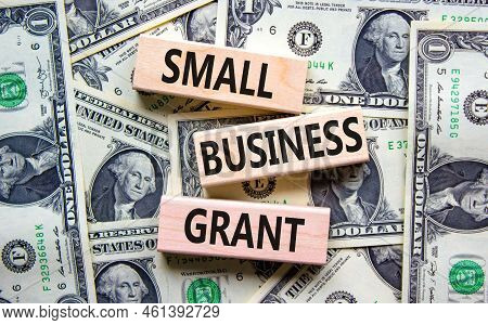 Small Business Grant Symbol. Concept Words Small Business Grant On Wooden Blocks On A Beautiful Back