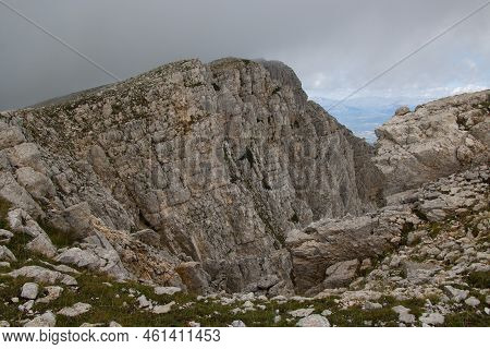 View Of Rocky And Wild Peak Of Sirente Mount In Abruzzo Covered By Clouds