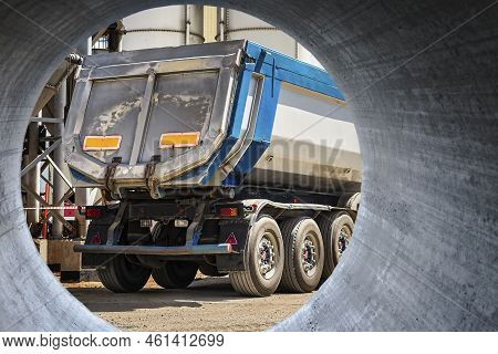 Large Dump Truck Near The Concrete Factory. Car Tonar For Transportation Of Heavy Bulk Cargo. Provis
