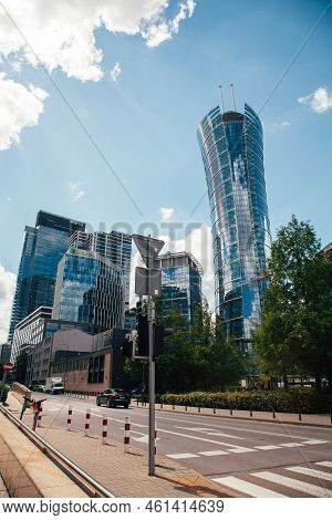 Warsaw, Poland - June 22, 2022: Neomodern Architecture. Business Center. Downtown City. Street Road 