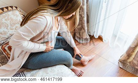 Ankle Pain Pregnant Woman. Pregnancy Girl Have Foot Cramp, Ankle Leg Pain Doing Health Massage Exerc