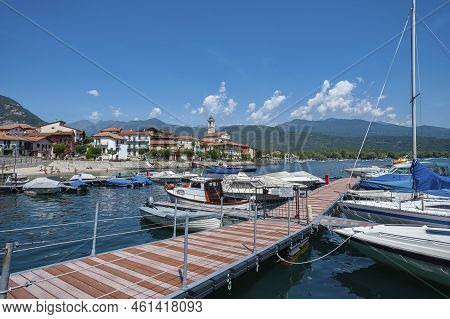 Small Harbor In Front Of The Village Of Feriolo On Lake Maggiore. Feriolo Is A Town In Piedmont In N