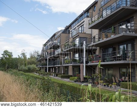 Lokeren, Belgium, August 27, 2022, Apartment Building With Balconies Overlooking The River Durme And
