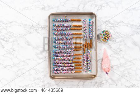 Mermaid Chocolate Pretzel Rods Drizzled With Pink And Purple Chocolate And Covered With Sprinkles.