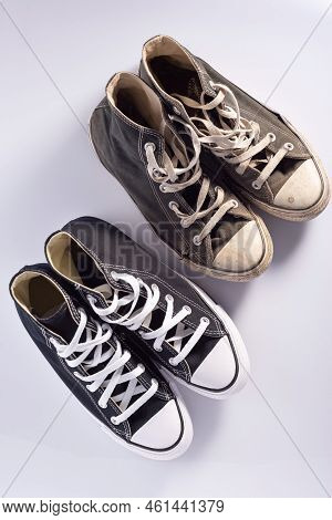 Old And New Classic Sneakers On A White Background