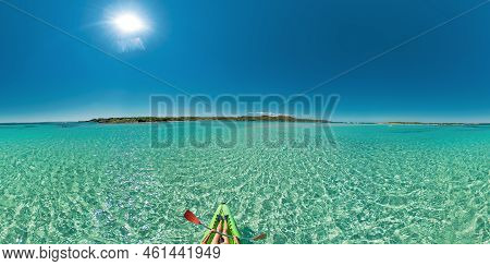 Drone View Of Woman Kayaking In The Mediterranean Sea By Piana Island. Aerial View Of A Kayak In The
