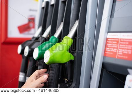 Woman At Self Service Fuel Pump In European Gas Station - Inflation, Rising Prices, Economy, Specula