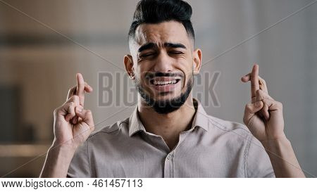Arabian Hopeful Employee Male Student Closed Eyes Cross Fingers Praying For Good Luck Faithful Hispa