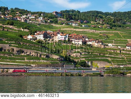 Rivaz, Switzerland - July 14, 2022: A Swiss Railways Train Passes The Village Of Rivaz On Lake Genev
