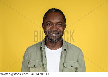 Headshot Of Smiling Confident Adult African American Male In Casual Looking At Camera