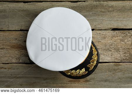 Peaked Cap With Accessories On Wooden Background, Top View
