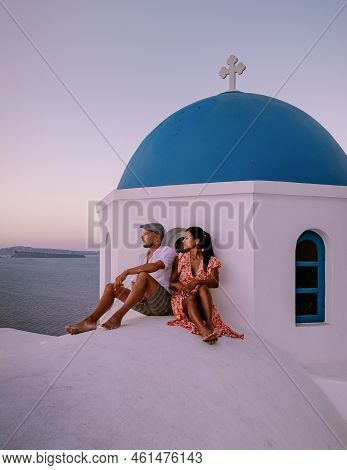 Couple Of Men And Women On Vacation In Santorini Greece, Couple Visit Oia Santorini