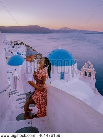 Couple Of Men And Women On Vacation In Santorini Greece, Couple Visit Oia Santorini