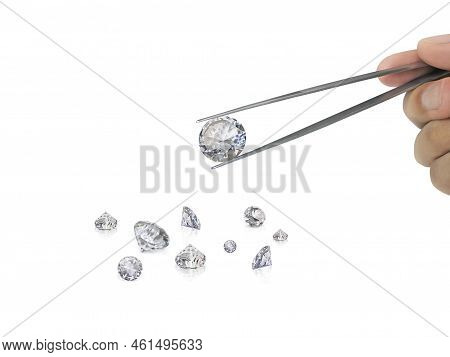 Selected Diamonds In The Gemstone Clamp For Making Jewelry On White Background