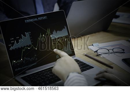 Businessman And Team Work Using Laptop Computer For Auditing The Financial Report Data Of The Compan