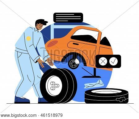 Automobile Service Concept. Young Male Auto Mechanic Or Service Station Employee Changes Wheels Or T