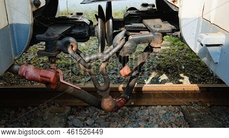 Close-up Detail Of Iron Connection Of Two Train Wagons. Railway Car Coupler And Train Buffers. Buffe