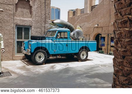 Dubai, Uae - April 15, 2021: Entrance View Of Al-fanar Seafood Market. Old Vintage Retro Jeep Truck 