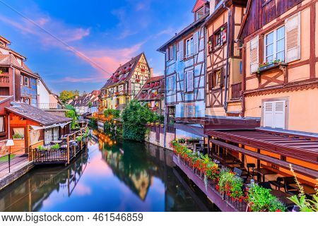 Colmar, Alsace, France. Petite Venice, Water Canal And Traditional Half Timbered Houses.