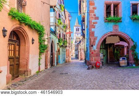 Riquewihr, France. Picturesque Street With Traditional Half Timbered Houses On The Alsace Wine Route