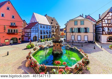 Eguisheim, France. Colorful Half-timbered Houses In Castle Square, Alsace.