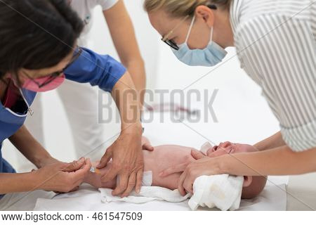 Baby Beeing Vaccinated By Pediatrician In Presence Of His Mother. Preventive Vaccination Against Dip