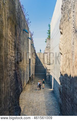 08.27.2022 - Belzec, Poland - Belzec Nazi Death Camp. Tall Stone Walls Of Former Nazi Death Camp. To