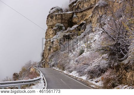 Serpentine Asphalt Road To The Village Of Gunib, Dagestan, Russia. Path In The Clouds. A Sharp Turn 